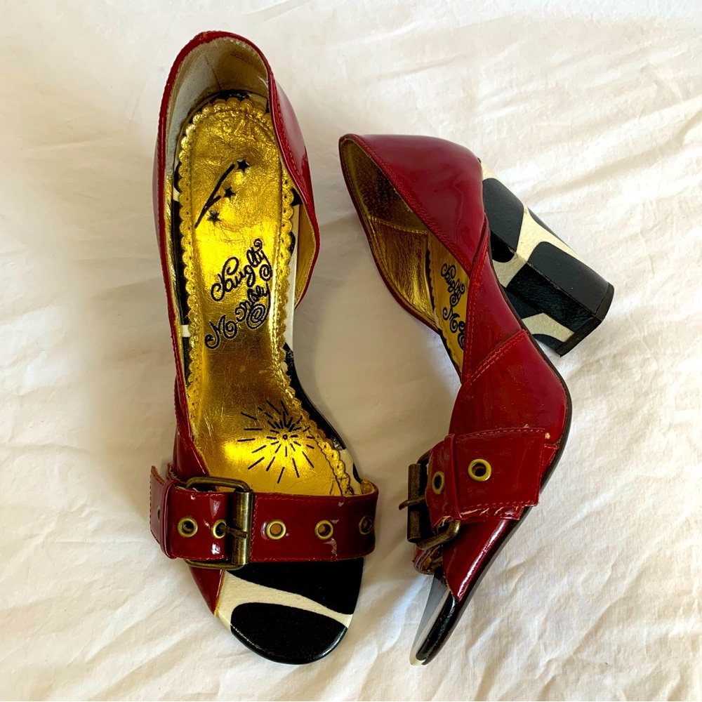 Naughty Monkey red patent and cow print asymmetric heels open toes buckle strap